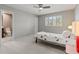 Bedroom with a view into the ensuite bathroom, natural light, and simple elegant style at 10293 E Sheri Ln, Englewood, CO 80111