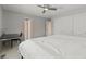 Spacious bedroom features a ceiling fan, double door closet, and white trim at 10293 E Sheri Ln, Englewood, CO 80111