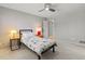Bedroom with bright bedside lamps and adjacent side tables and a ceiling fan at 10293 E Sheri Ln, Englewood, CO 80111
