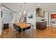 Contemporary dining area boasts modern table, stylish chairs, and convenient coffee bar with sleek cabinetry and stainless steel appliances at 10293 E Sheri Ln, Englewood, CO 80111