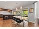 Open dining area featuring a wood table, stylish chairs, and a view to the outdoor space at 10293 E Sheri Ln, Englewood, CO 80111