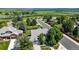 Charming home with mature trees, lush landscaping, and well-maintained lawns in a friendly neighborhood at 10293 E Sheri Ln, Englewood, CO 80111
