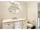Bathroom features a vanity with marble countertop, an oval mirror, updated lighting, and neutral paint at 140 E Highline Cir # 304, Centennial, CO 80122