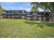 Brick exterior with private balconies and a spacious lawn offers a serene living environment at 140 E Highline Cir # 304, Centennial, CO 80122