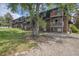 Attractive brick exterior with balconies, complemented by mature trees and stone landscaping at 140 E Highline Cir # 304, Centennial, CO 80122