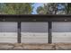 Attached one car garages with painted white doors and neutral trim at 140 E Highline Cir # 304, Centennial, CO 80122