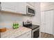 Well-equipped kitchen with stainless steel appliances and ample storage, perfect for cooking and entertaining at 140 E Highline Cir # 304, Centennial, CO 80122