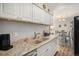 Bright kitchen with modern countertops, stainless steel sink, and stylish decor for easy meal preparation at 140 E Highline Cir # 304, Centennial, CO 80122