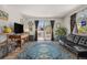 Bright living room featuring modern decor, hardwood floors, and a balcony with a view at 140 E Highline Cir # 304, Centennial, CO 80122