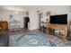 Open-concept living area flowing into dining, featuring stylish furnishings and modern flooring at 140 E Highline Cir # 304, Centennial, CO 80122