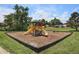 Playground with slides, climbing structures, and a mulch base at 140 E Highline Cir # 304, Centennial, CO 80122