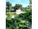 Picturesque pond with a fountain surrounded by lush greenery and views of nearby townhouses at 140 E Highline Cir # 304, Centennial, CO 80122