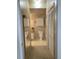 Bathroom with a view down the hall, displaying a mirror and full bath fixtures at 1659 Harris St, Superior, CO 80027