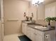 Bright bathroom featuring double sinks, granite countertops and a decorative mirror for added elegance at 1659 Harris St, Superior, CO 80027