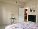 Comfortable bedroom featuring a floral patterned bedspread, dresser, and doorway to the main living area at 1659 Harris St, Superior, CO 80027