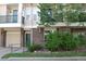 Charming townhome with brick facade, green door, and well-maintained landscaping at 1659 Harris St, Superior, CO 80027
