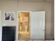 Hallway featuring access to the bathroom and closet from the main bedroom at 1659 Harris St, Superior, CO 80027