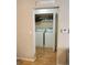 Convenient laundry room with washer, dryer, and storage shelving, easily accessible from the main living area at 1659 Harris St, Superior, CO 80027
