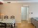 Open-concept living area with dining space, hardwood floors, and access to a closet at 1659 Harris St, Superior, CO 80027