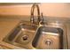 Close-up of stainless steel kitchen sink and granite countertop at 1659 Harris St, Superior, CO 80027