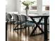 Dining room with stylish table with six chairs, hardwood floors, and great natural light at 1912 W 38Th Ave, Denver, CO 80211