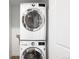 Updated laundry room featuring stacked washer and dryer at 1912 W 38Th Ave, Denver, CO 80211