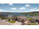Aerial view of the house with views of a lake and open space at 3255 Waterfront Dr, Monument, CO 80132