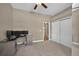 Bedroom with a ceiling fan, closet with mirrored doors, and desk at 3255 Waterfront Dr, Monument, CO 80132