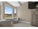 Comfortable bedroom with a reading nook with large windows offering scenic views at 3255 Waterfront Dr, Monument, CO 80132
