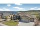Aerial shot of a home with a three-car garage near a lake, showcasing its stunning views at 3255 Waterfront Dr, Monument, CO 80132
