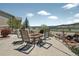 Backyard fire pit area with seating and scenic lake views, perfect for outdoor entertaining at 3255 Waterfront Dr, Monument, CO 80132