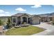 Charming home with beautiful landscaping, a well-manicured lawn and large driveway at 3255 Waterfront Dr, Monument, CO 80132