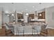 Open kitchen with stainless steel appliances, a large granite island, and bar seating at 3255 Waterfront Dr, Monument, CO 80132