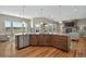 Modern kitchen with an island, stainless steel appliances, and views of the outdoor landscape at 3255 Waterfront Dr, Monument, CO 80132