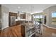 Spacious kitchen featuring stainless steel appliances, a large island, and hardwood floors at 3255 Waterfront Dr, Monument, CO 80132