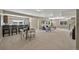 Open concept living space with dining area, plush seating, and staircase to the next level at 3255 Waterfront Dr, Monument, CO 80132