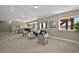 Open-concept living room and dining area, featuring modern furnishings and large windows at 3255 Waterfront Dr, Monument, CO 80132