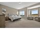 Spacious main bedroom featuring plush carpet, seating area, and scenic views at 3255 Waterfront Dr, Monument, CO 80132