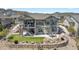 Beautiful home with a large backyard, stone retaining wall, patio, and stairs to upper deck at 3255 Waterfront Dr, Monument, CO 80132