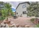 Expansive stone patio with outdoor dining and a glimpse of the home's well-maintained exterior at 8216 S Krameria Way, Centennial, CO 80112