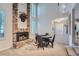 Inviting dining area with brick fireplace, soaring ceilings, and natural light at 8216 S Krameria Way, Centennial, CO 80112