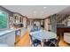 Bright kitchen with an island cooktop, stainless steel appliances, and hardwood flooring at 8216 S Krameria Way, Centennial, CO 80112