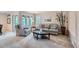Bright living room features large windows, comfortable seating, and a view of the outdoor patio area at 8216 S Krameria Way, Centennial, CO 80112