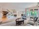 Open living room boasts a seamless flow, with a view of the staircase and dining area at 8216 S Krameria Way, Centennial, CO 80112