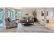 Bright living room showcases a comfortable seating arrangement and large windows offering plenty of natural light at 8216 S Krameria Way, Centennial, CO 80112