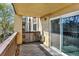 Outdoor balcony space with concrete floor and stucco facade, connected to main bedroom at 7040 E Girard Ave # 406, Denver, CO 80224