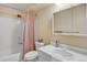 This bathroom features a shower and tub, vanity, a large mirror and a toilet at 7040 E Girard Ave # 406, Denver, CO 80224