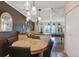 Dining area with pendant lights and views into the living room and billiards room at 7040 E Girard Ave # 406, Denver, CO 80224
