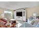 Inviting living room features a large built-in entertainment center and comfortable seating area at 7040 E Girard Ave # 406, Denver, CO 80224