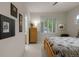 Cozy bedroom featuring neutral walls, carpet, window with shutters, and a wooden framed bed at 10524 Serengeti Dr, Lone Tree, CO 80124